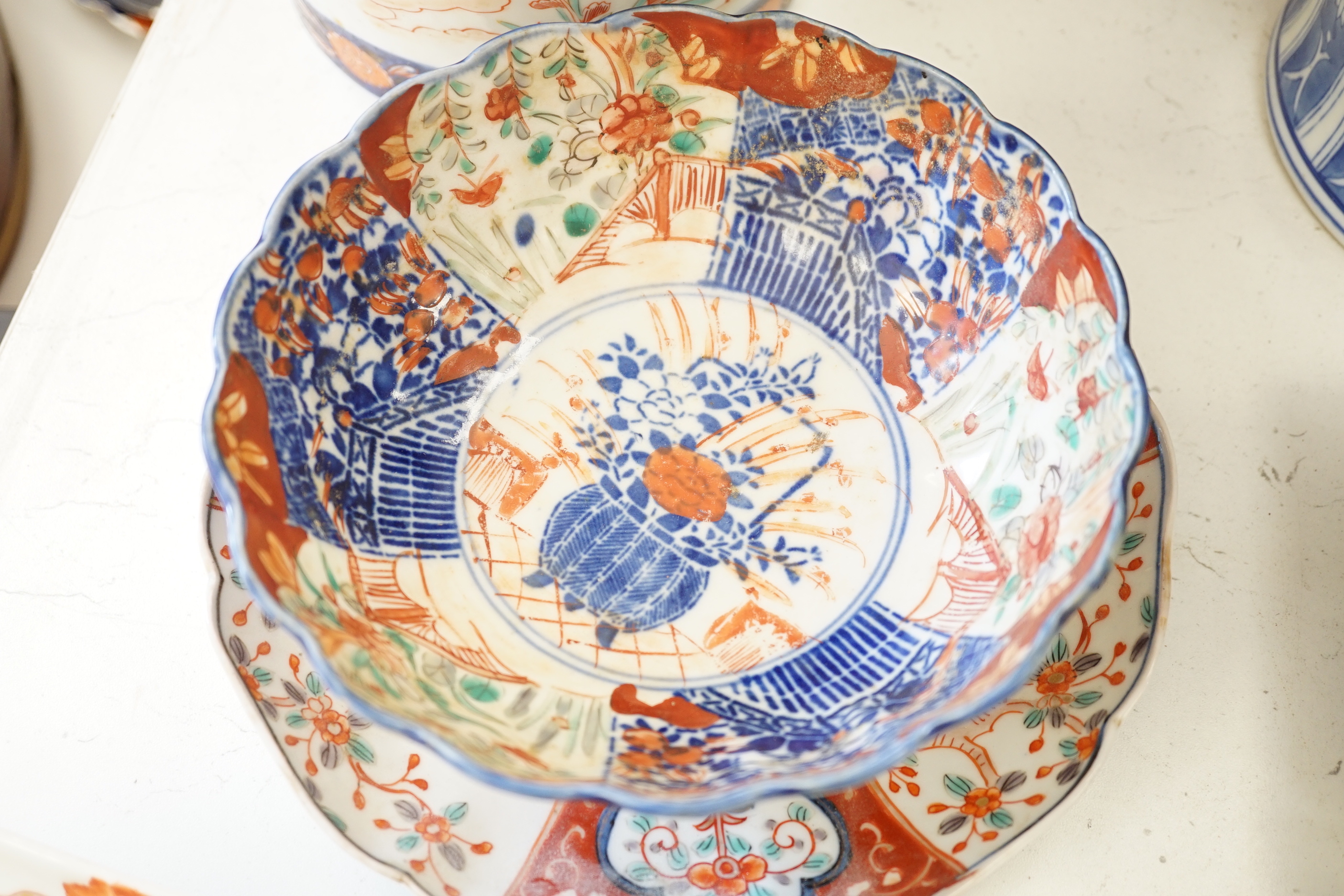 A Japanese Imari vase, a Chinese blue and white vase, two dishes, a bowl and a set of five dishes (10)